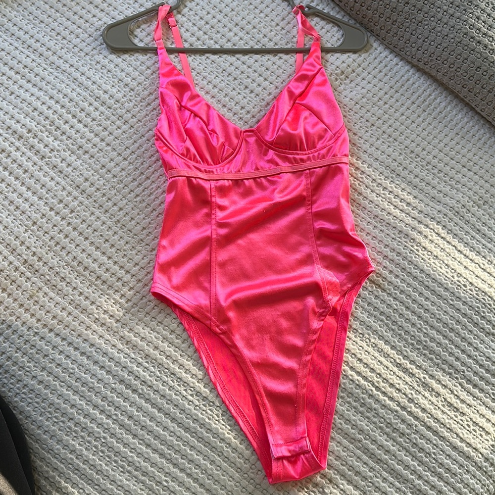 Neon pink body suit